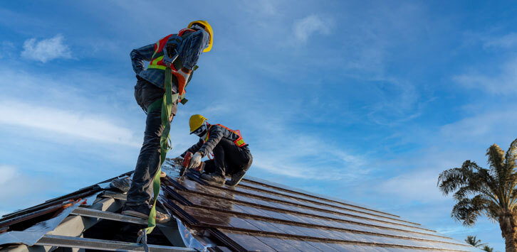 men repairing a roof